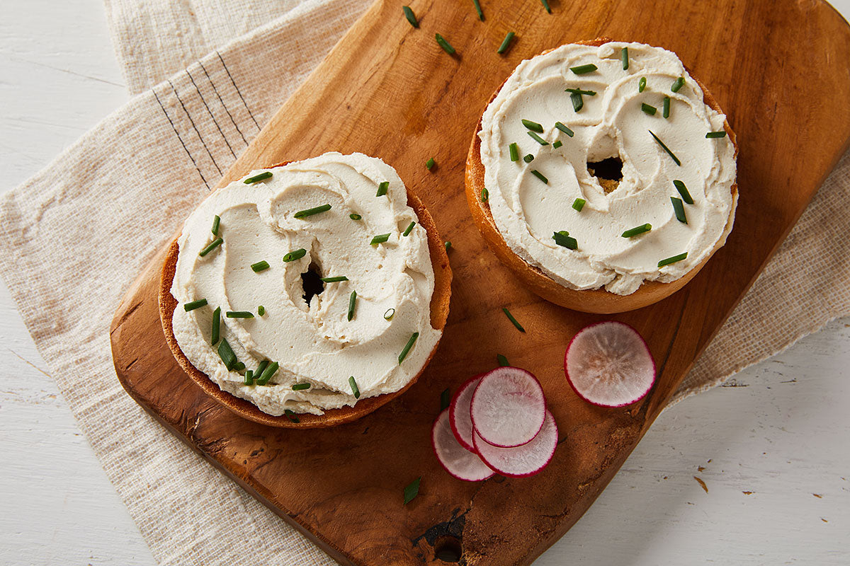 2 bagel halves with vegan cream cheese and chives