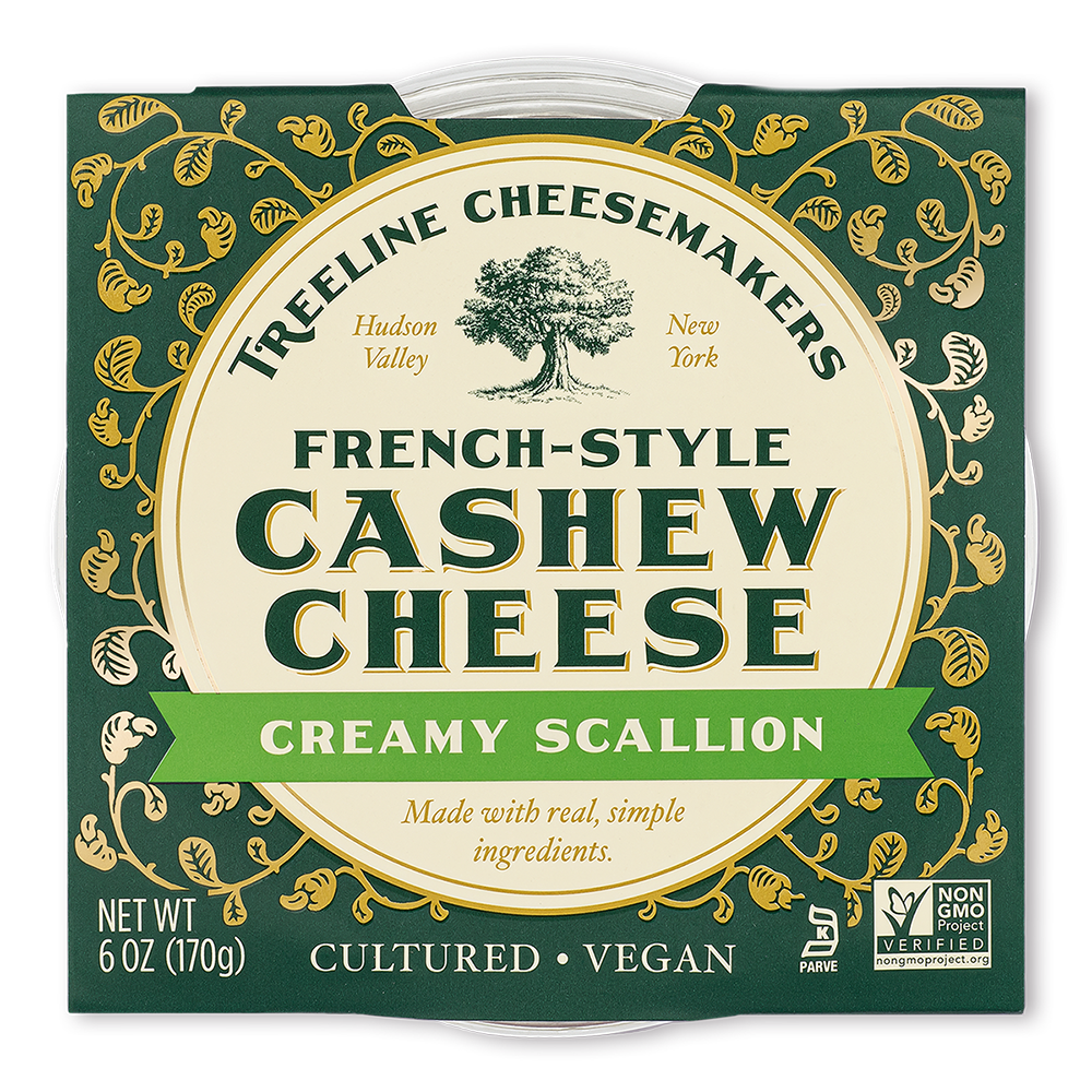 Treeline Creamy Scallion French-Style Cashew Cheese in its green and gold packaging