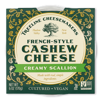 Treeline Creamy Scallion French-Style Cashew Cheese in its green and gold packaging