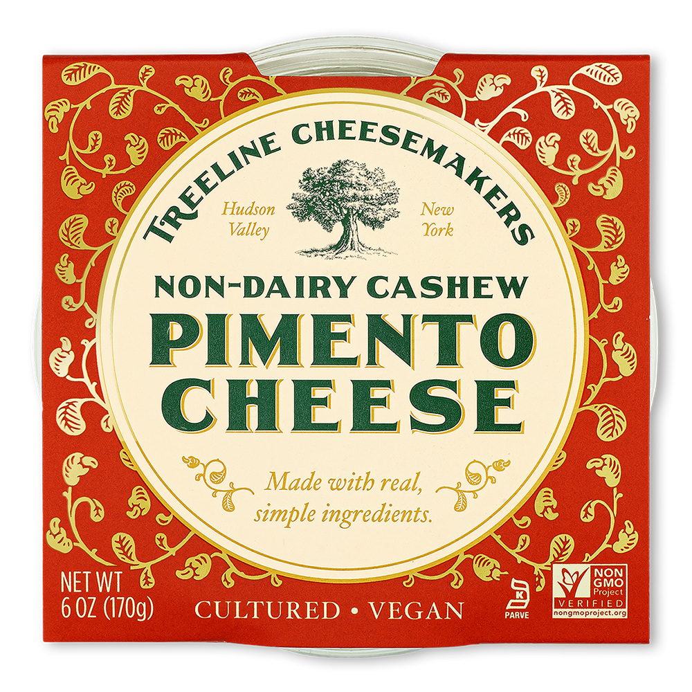 Treeline Non-Dairy Cashew Pimento Cheese in its red and gold packaging