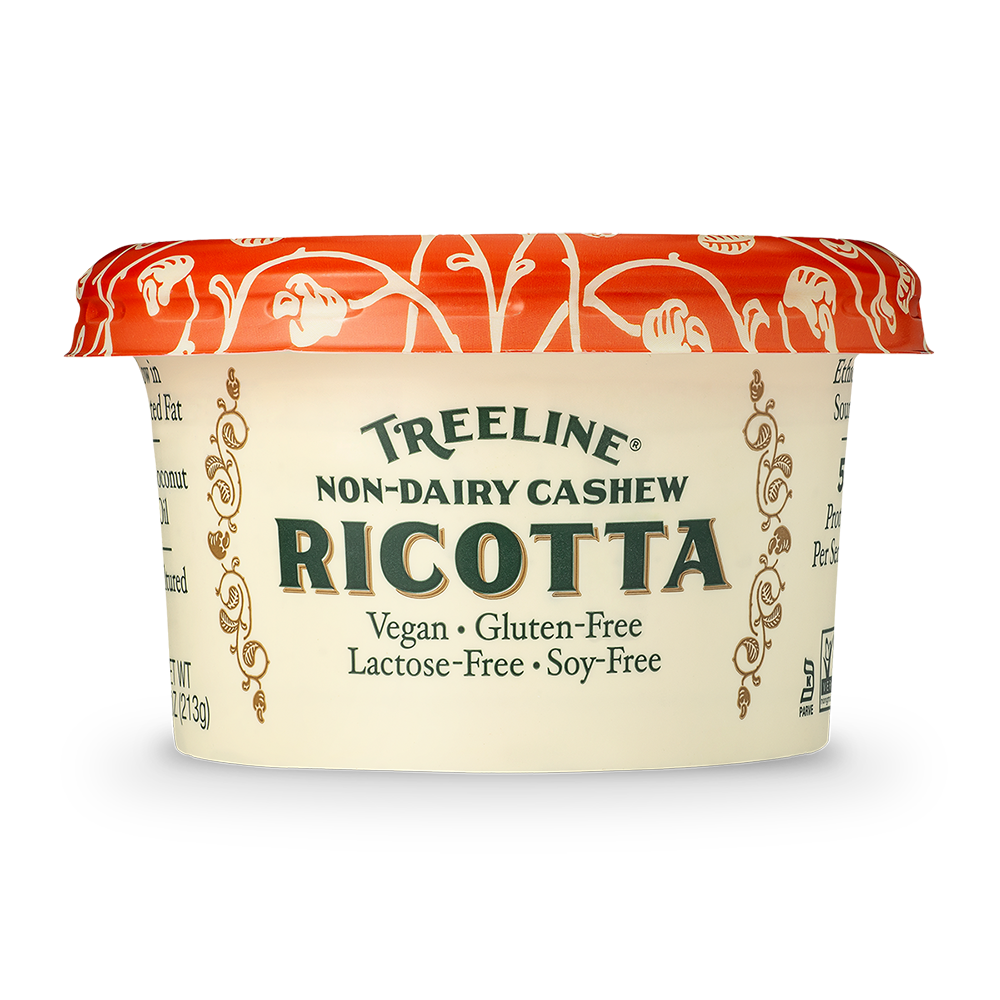 Treeline Non-Dairy Cashew Ricotta cheese in its red, green, and cream packaging