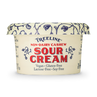 Treeline Non-Dairy Cashew Sour Cream in its cream, red, and blue packaging